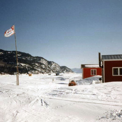 Ice fishing on saltwater out of a cabin